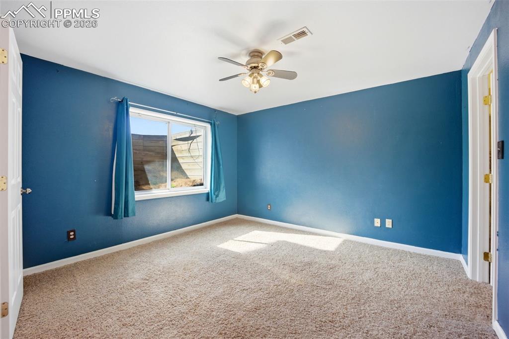 Image 37 of 50: Basement bedroom with garden level window