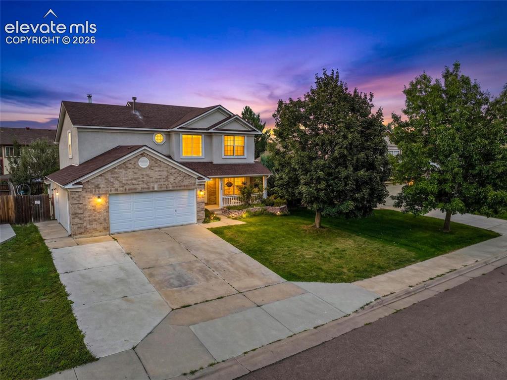 Image 1 of 50: Two-story residence featuring an oversized two-car garage, brick facade det