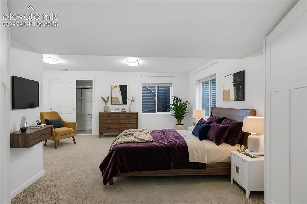 Image 37 of 50: Carpeted bedroom featuring white walls, recessed lighting, a built-in close