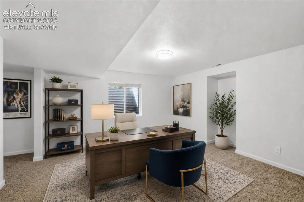 Image 40 of 50: Virtually staged Carpeted room with a window with blinds, and recessed ligh