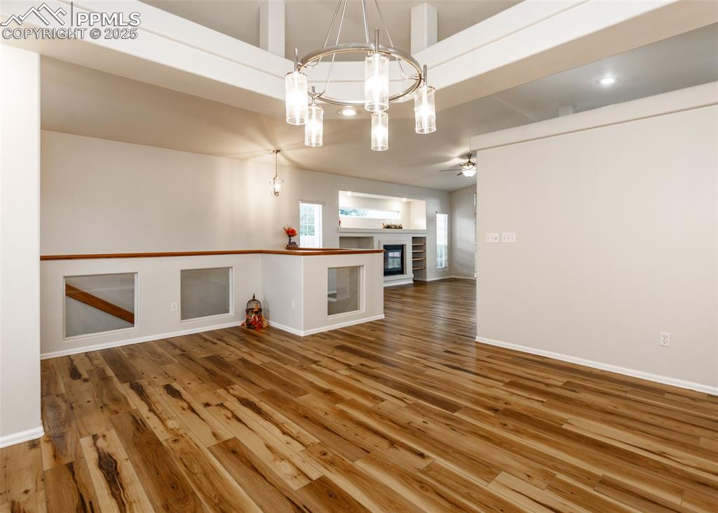 Image 8 of 43: View from dining room to living room and staircase