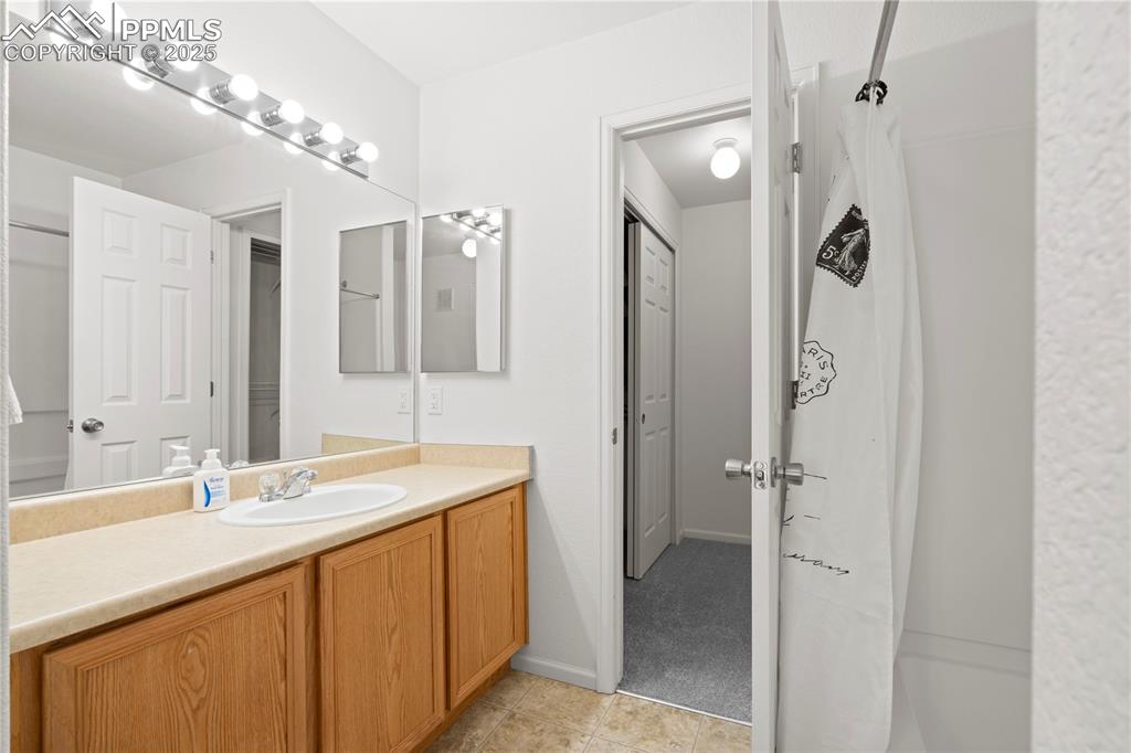Image 19 of 29: Full bath featuring vanity and tile patterned flooring