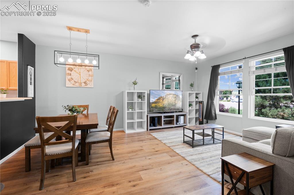 Image 6 of 29: Living area with light wood-type flooring and baseboards