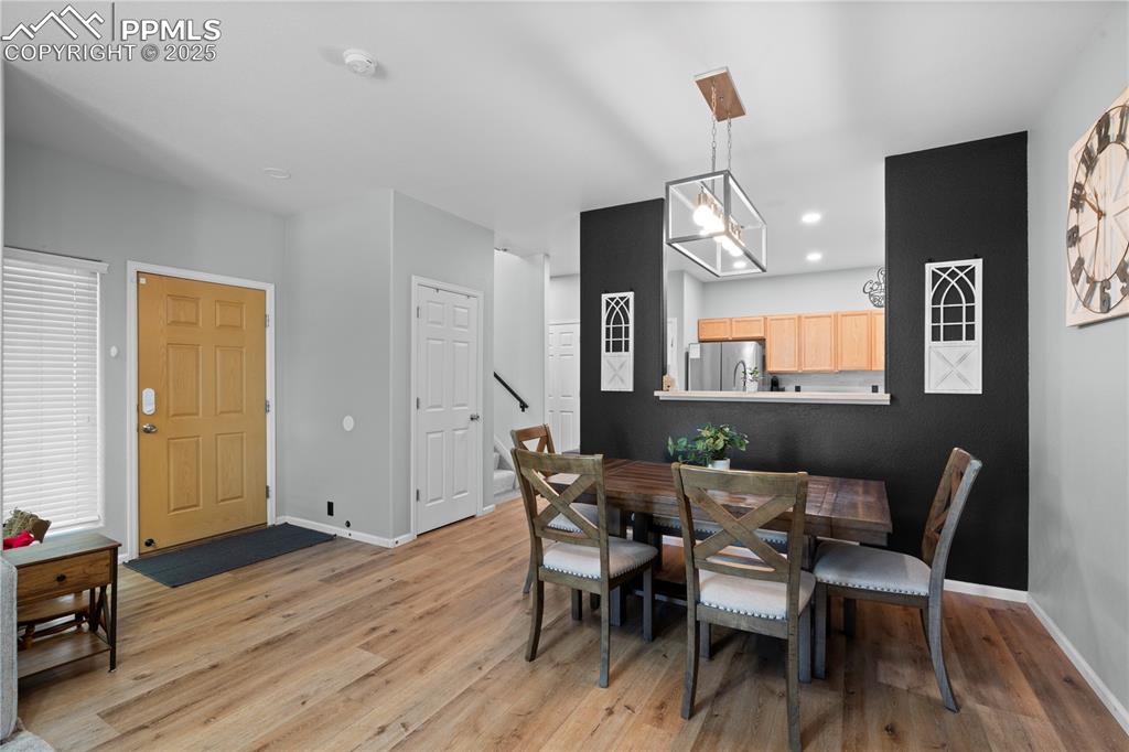 Image 9 of 29: Dining area featuring light wood-type flooring and recessed lighting