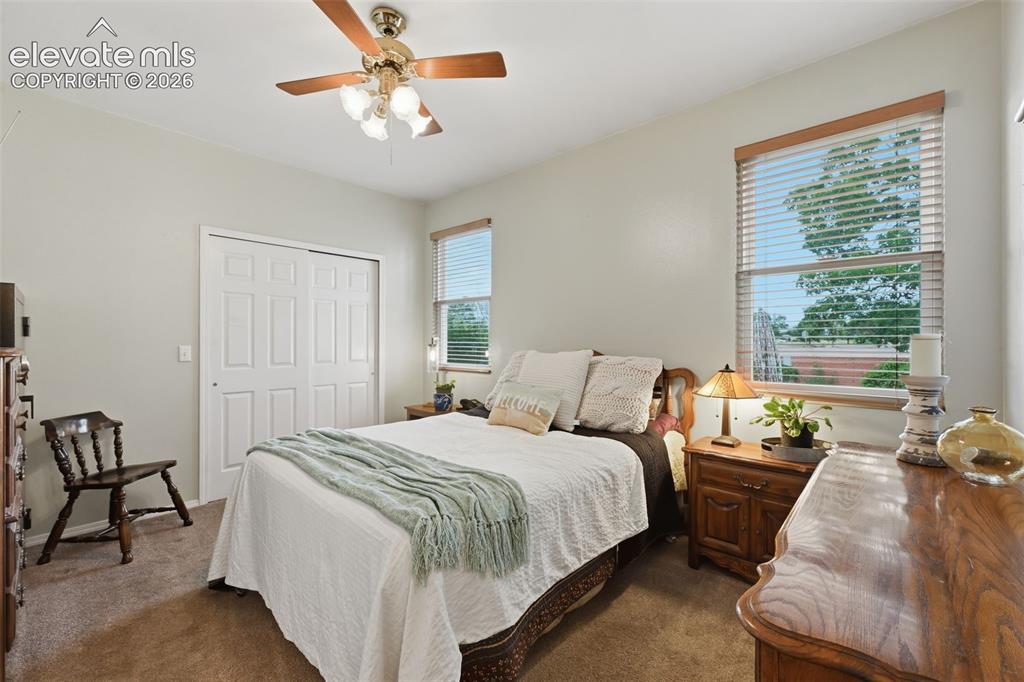 Image 12 of 31: Main level master bedroom also has some views!