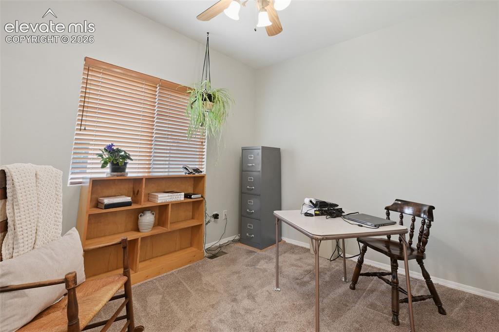Image 15 of 31: Main level second bedroom being used as an office!