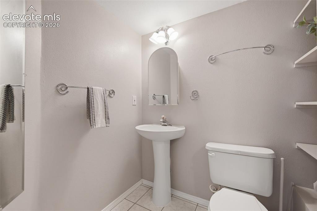 Image 24 of 31: Three quarter bath in the basement hall!