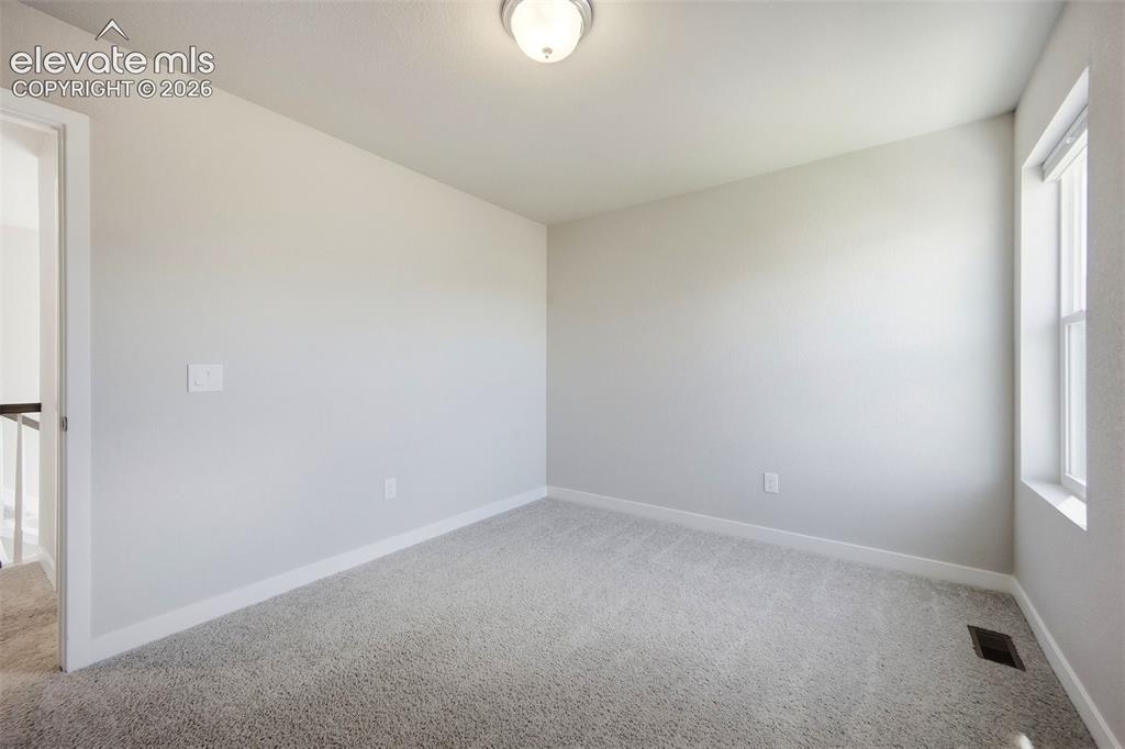 Image 24 of 49: Upstairs secondary bedroom 2