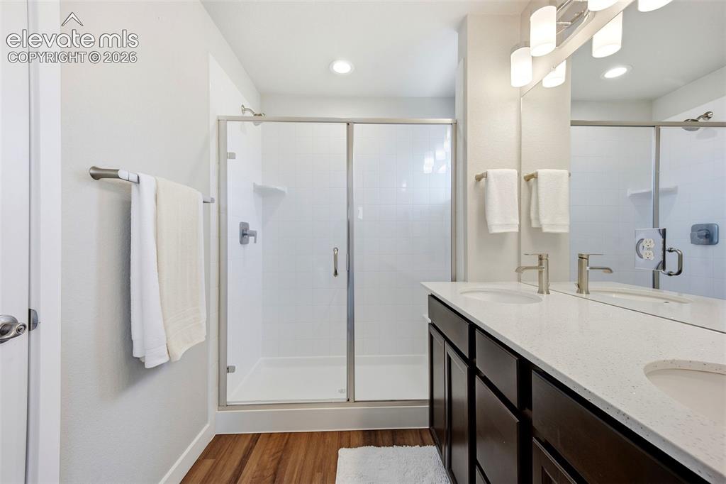 Image 29 of 49: Primary bath with walk in spa shower