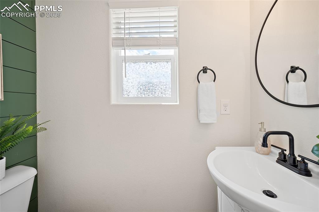 Image 10 of 50: Bathroom with a sink and toilet
