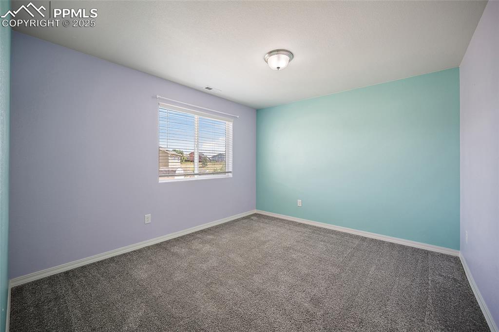 Image 27 of 50: Unfurnished room featuring carpet flooring