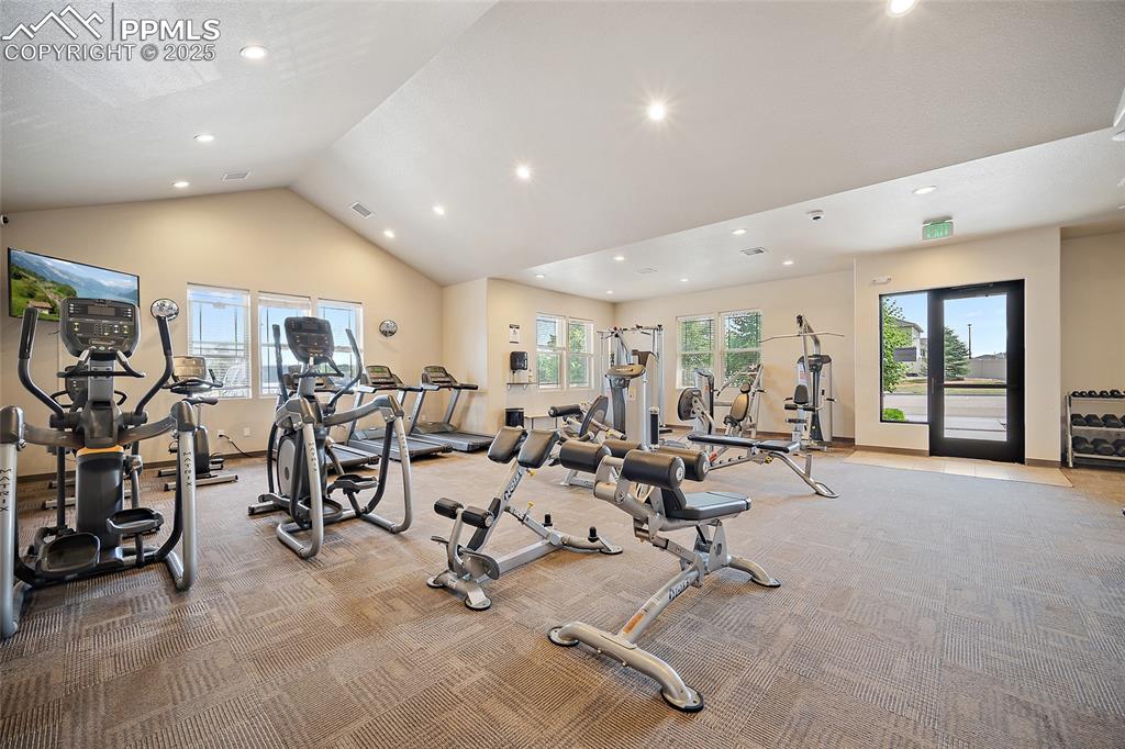 Image 37 of 50: Exercise room featuring recessed lighting, light colored carpet, and high v