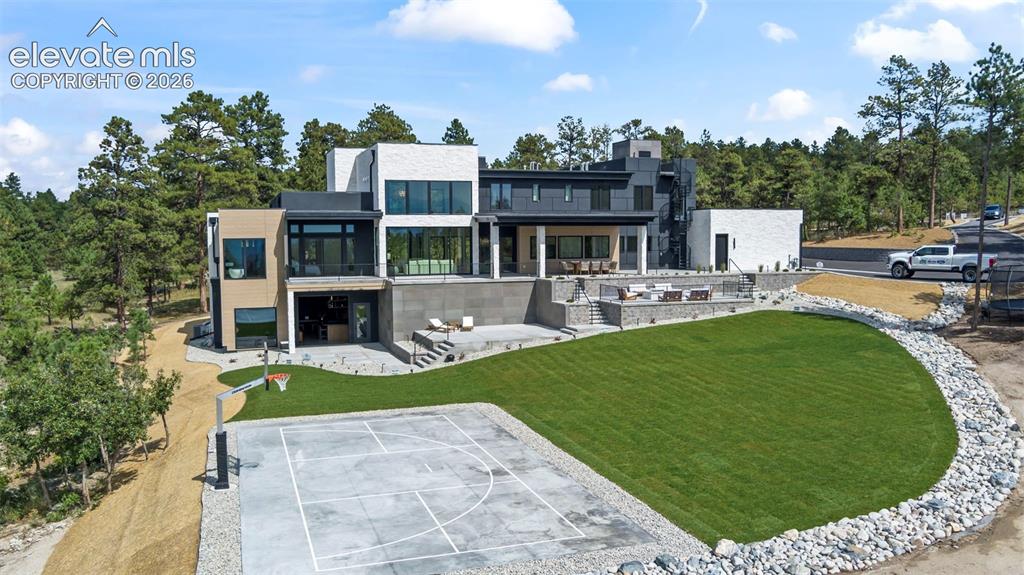 Image 1 of 50: Hugh deck, pickle ball and basketball court