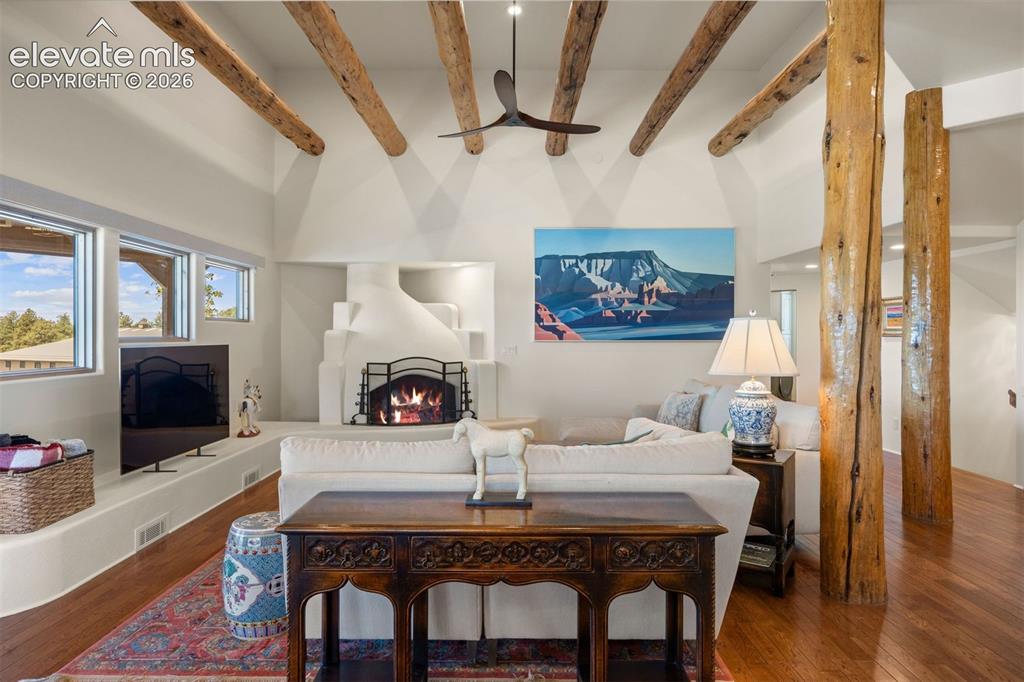 Image 17 of 46: Double doors open from the foyer into an expansive open great room flowing