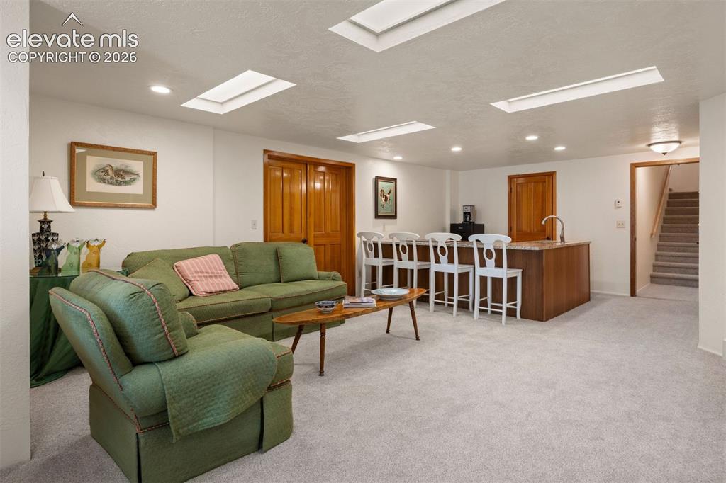 Image 26 of 46: Exceptional in-law suite or separate living potential in lower level, featu