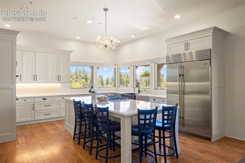 Image 3 of 46: The kitchen features Wolf and Sub-Zero appliances, an extra-large center is