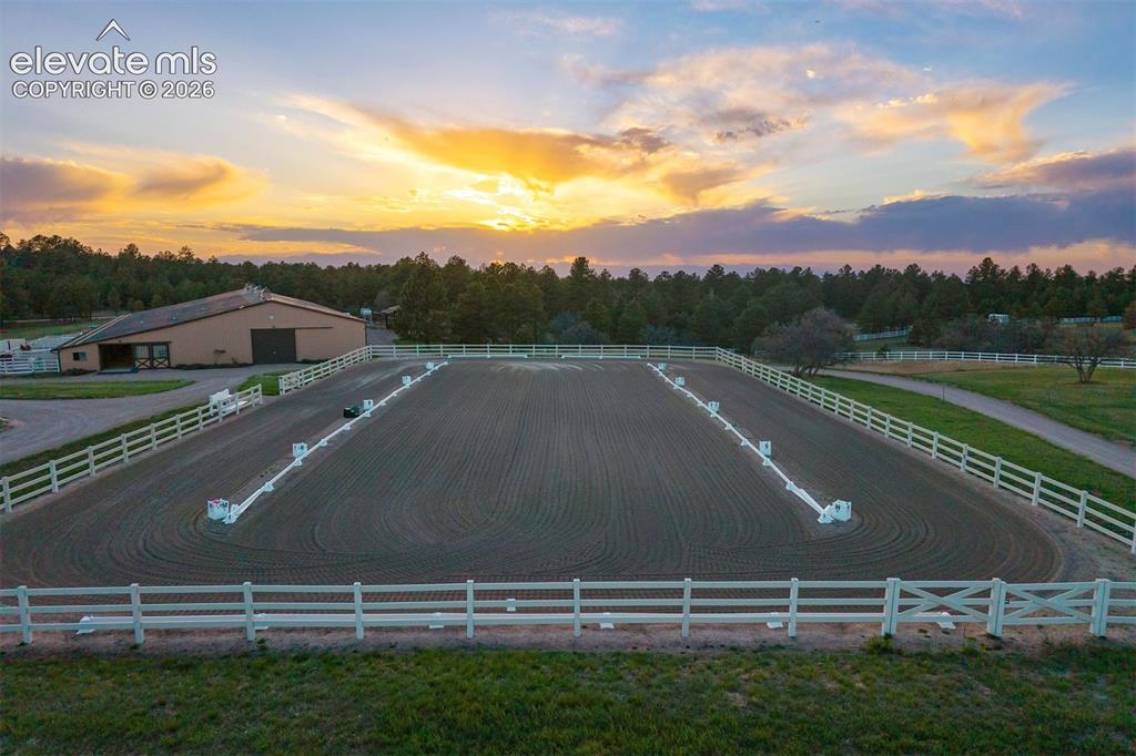 Image 42 of 46: A large chicken coop homes 12 chickens, with 9 nesting spots, an outdoor ru