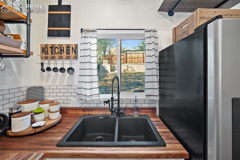 Image 12 of 36: Bedroom or Office featuring dark wood-type flooring and baseboards