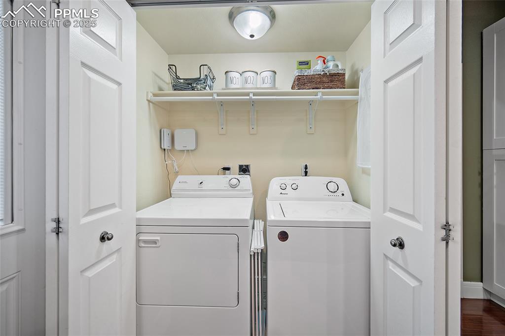 Image 18 of 36: Kitchen featuring wooden counters and freestanding refrigerator