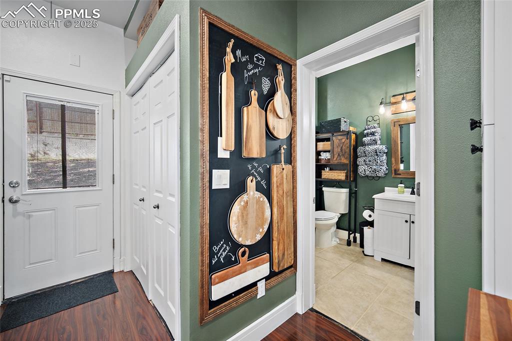 Image 19 of 36: Kitchen featuring wooden counters, a peninsula, range with electric cooktop