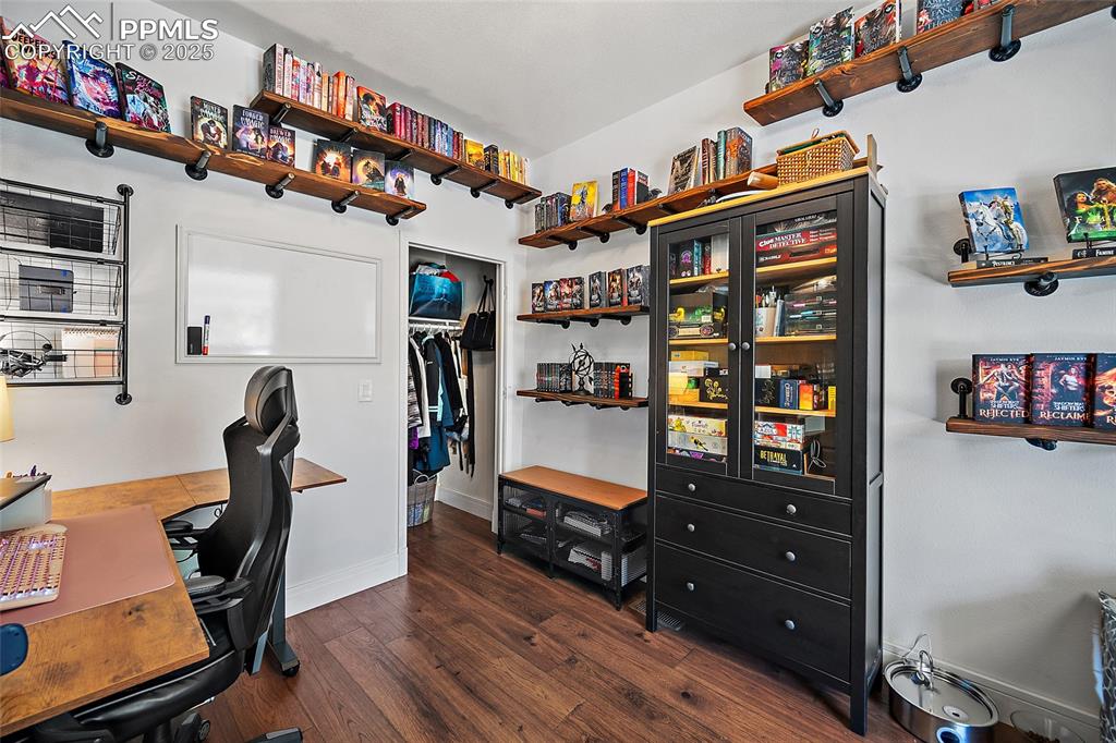 Image 23 of 36: Kitchen with white cabinets, dark wood-type flooring, wooden counters, and