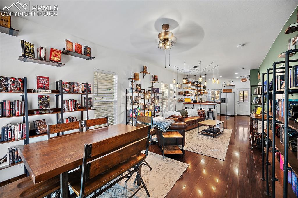 Image 5 of 36: Living room with dark wood finished floors