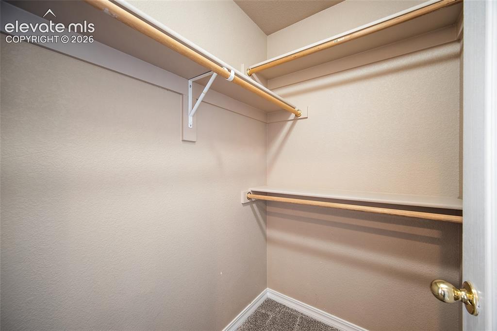 Image 28 of 40: walk in closet primary 