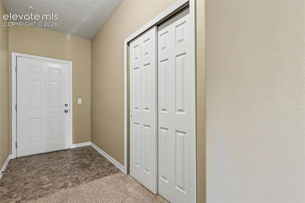 Image 6 of 34: Entry hall with coat closet