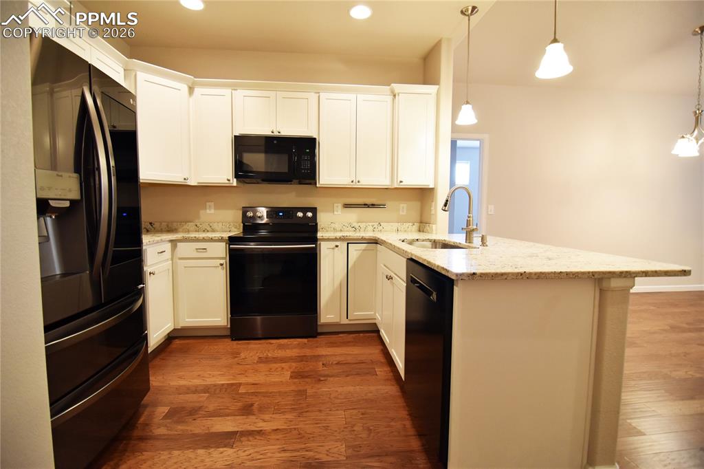 Image 10 of 29: Compact with bar seating area!
