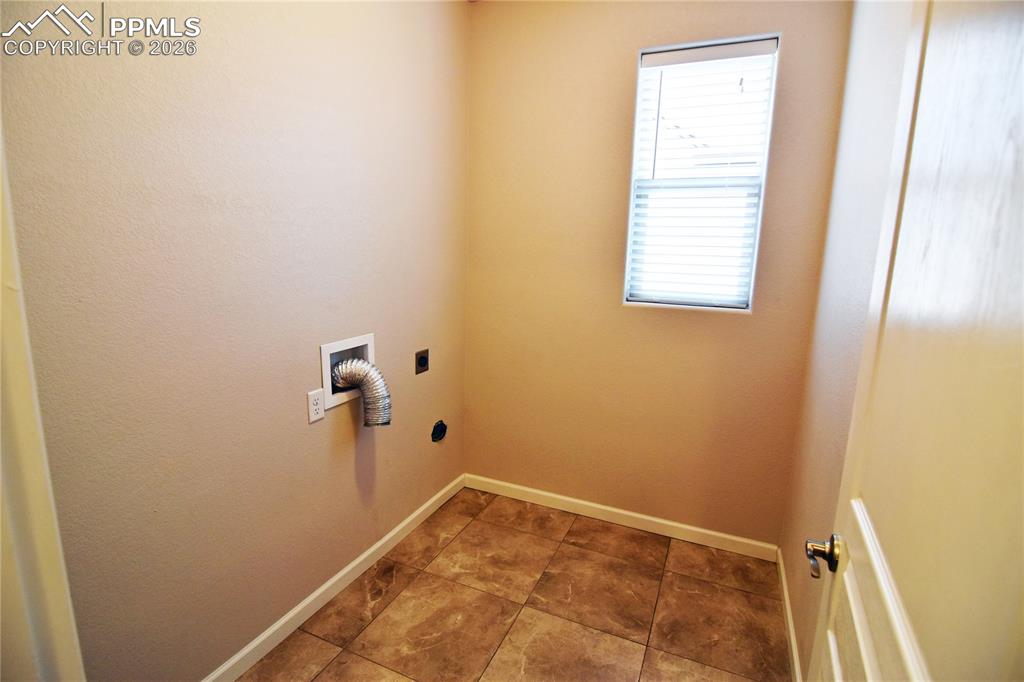 Image 12 of 29: Main level laundry