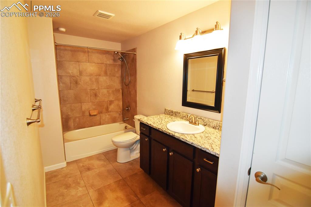 Image 26 of 29: Full bath with linen closet!