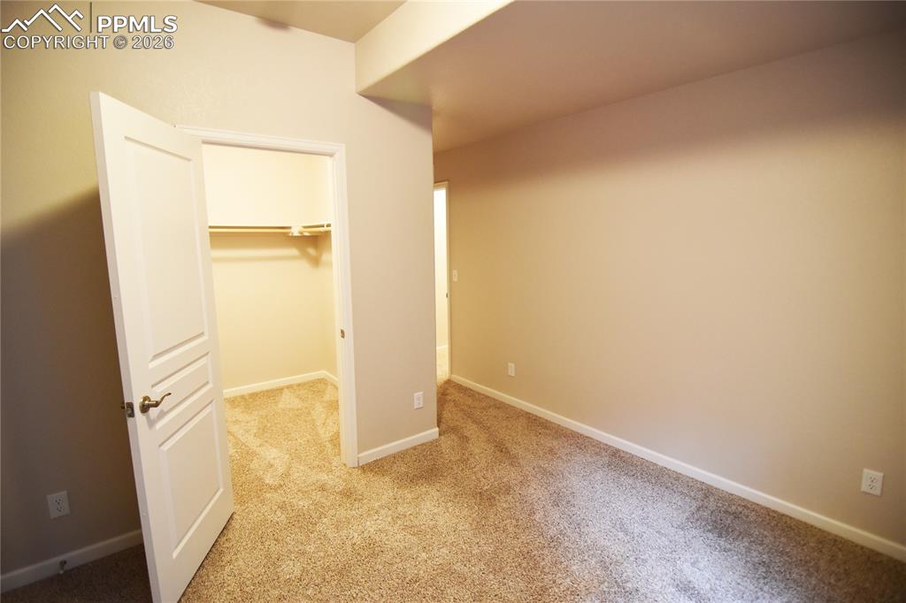 Image 28 of 29: Basement bedroom 2 with large walking closet!