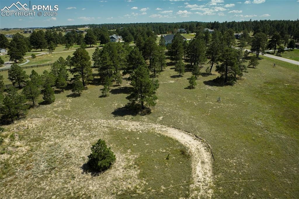 Image 12 of 16: Aerial view of property and surrounding area