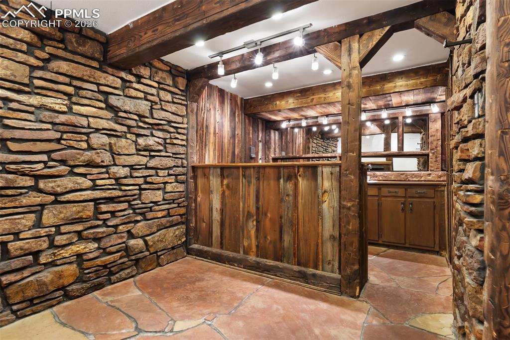 Image 27 of 44: Hidden bar behind bookshelf in sitting room