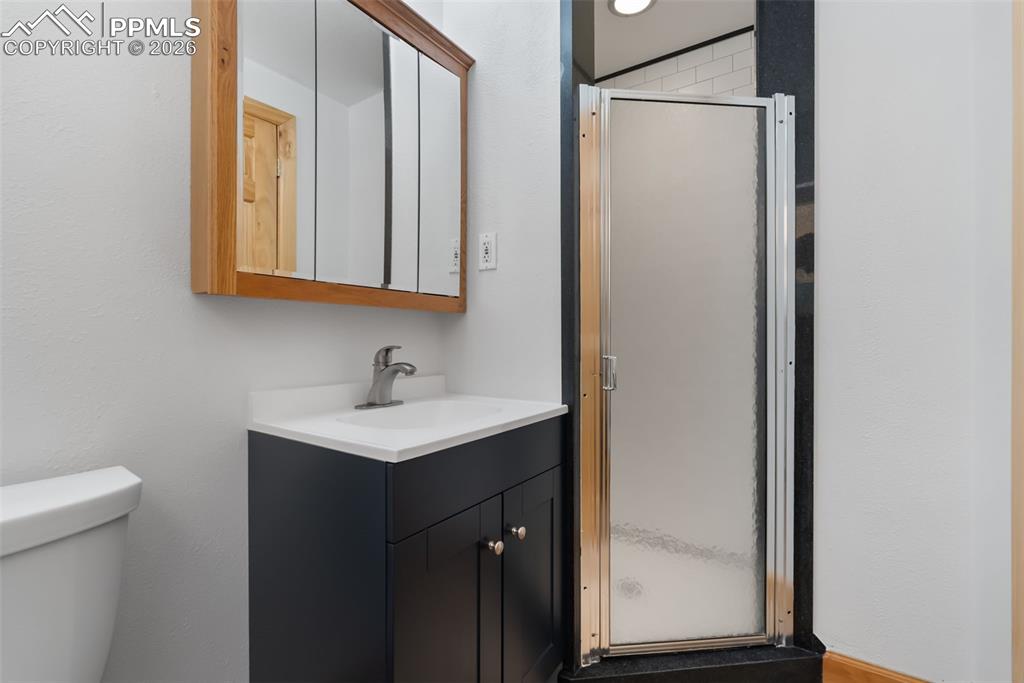 Image 32 of 44: 3/4 bath on main level