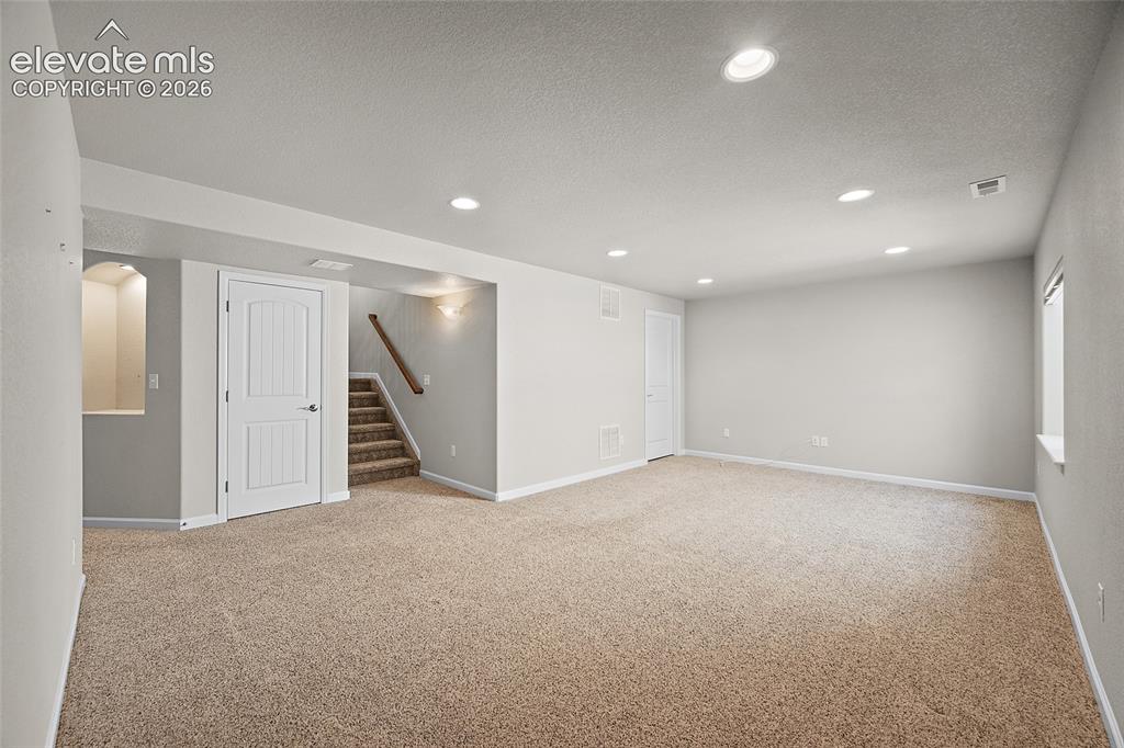 Image 21 of 42: basement living/entertainment