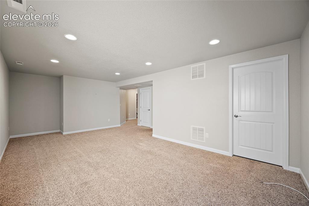 Image 22 of 42: basement living/entertainment