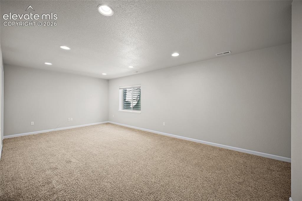 Image 23 of 42: basement living/entertainment