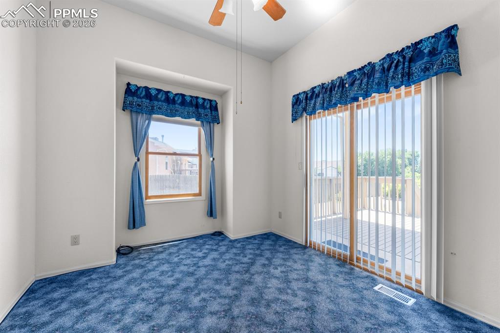 Image 10 of 38: Carpeted empty room with a ceiling fan and baseboards