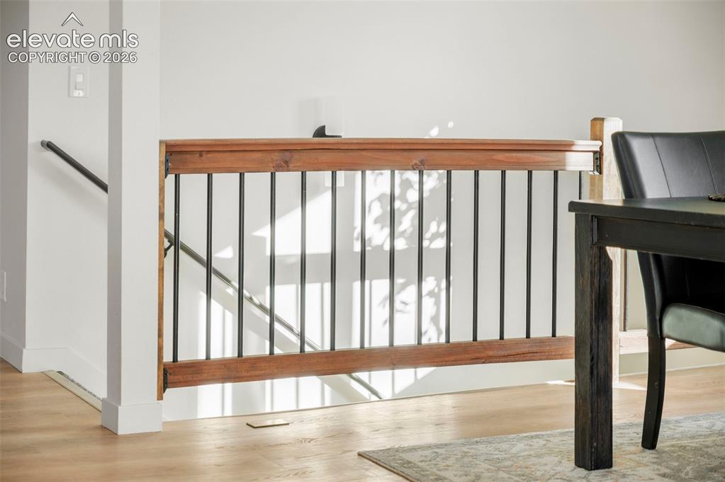 Image 20 of 49: Wood-finish flooring provides a warm aesthetic