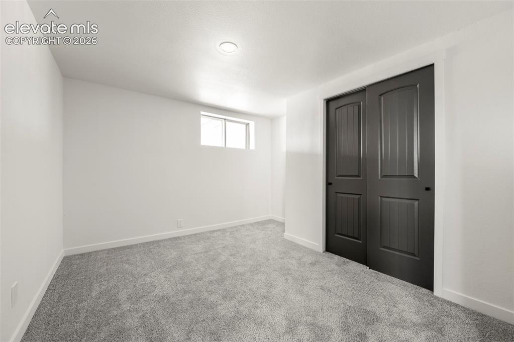 Image 42 of 49: Room featuring light gray carpeting, crisp white walls, a recessed ceiling 