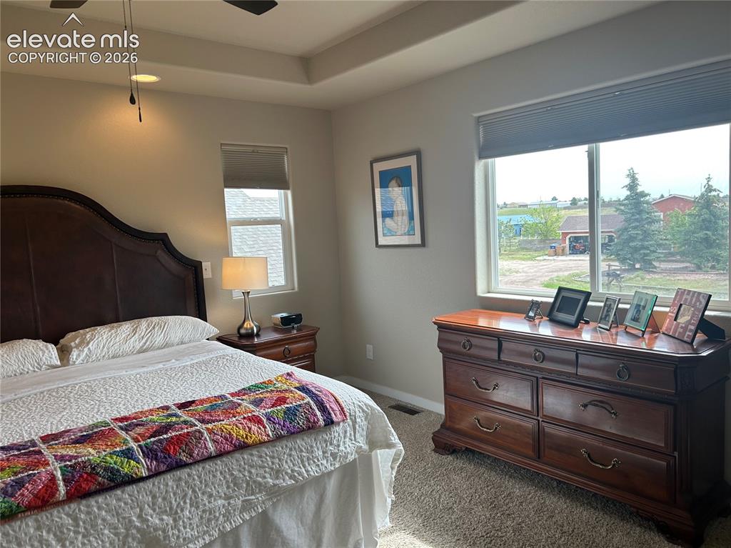 Image 12 of 22: Light and welcoming overlooking large lots 