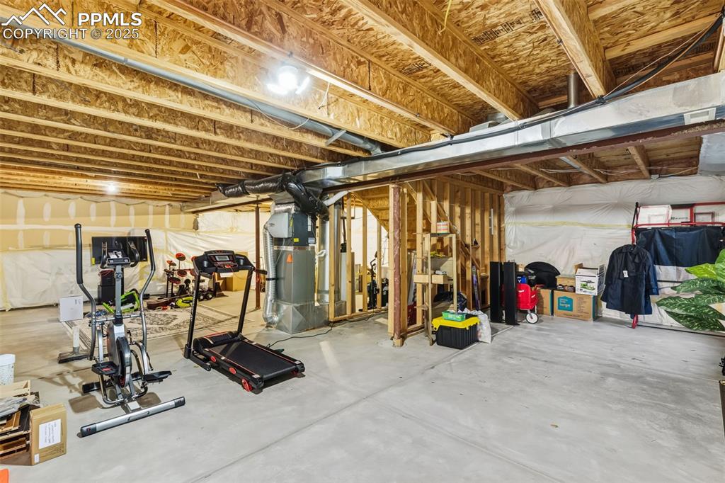 Image 24 of 33: Unfinished basement featuring heating unit