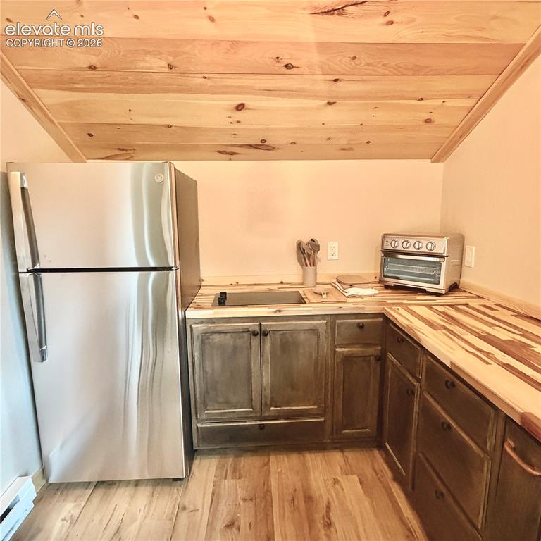 Image 12 of 45: Wood-finish flooring with a wood-plank ceiling