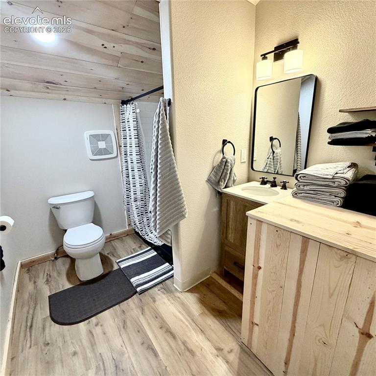 Image 16 of 45: Wood-finish flooring throughout