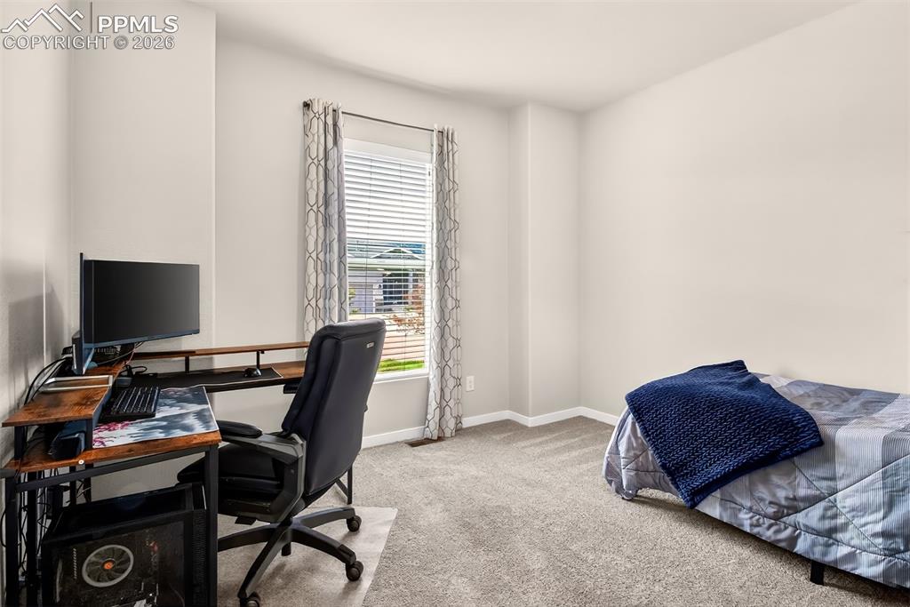 Image 6 of 40: Main level front bedroom