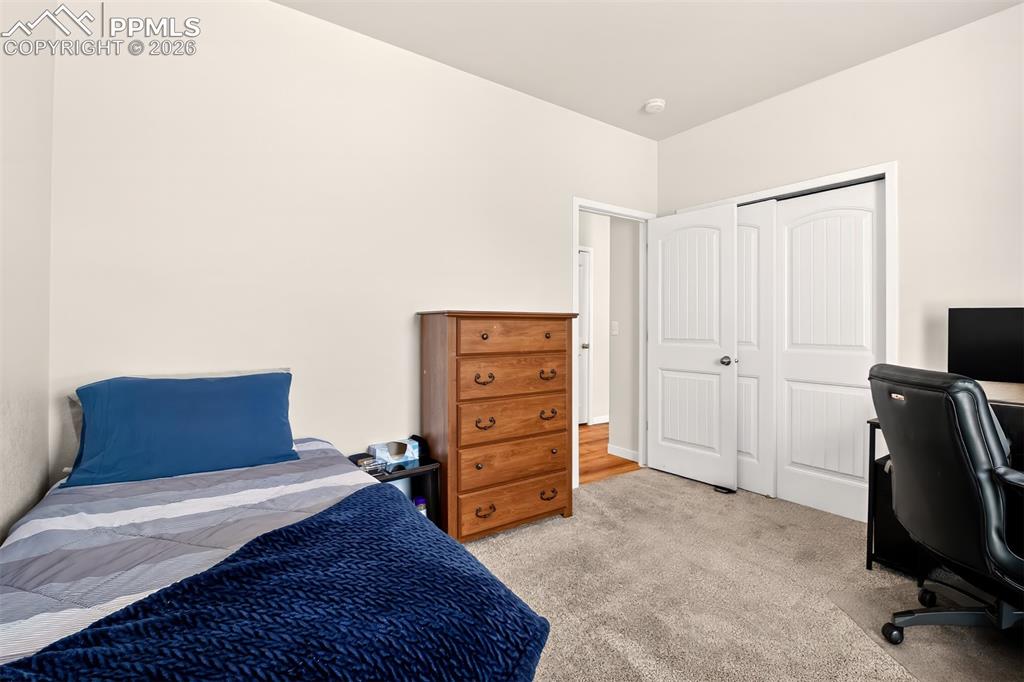 Image 7 of 40: Main level front bedroom