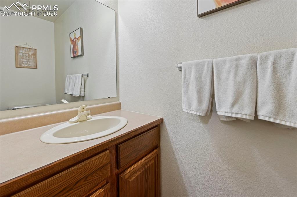 Image 12 of 49: New LVP Flooring/Door Leads to 2 Car Insulated Garage