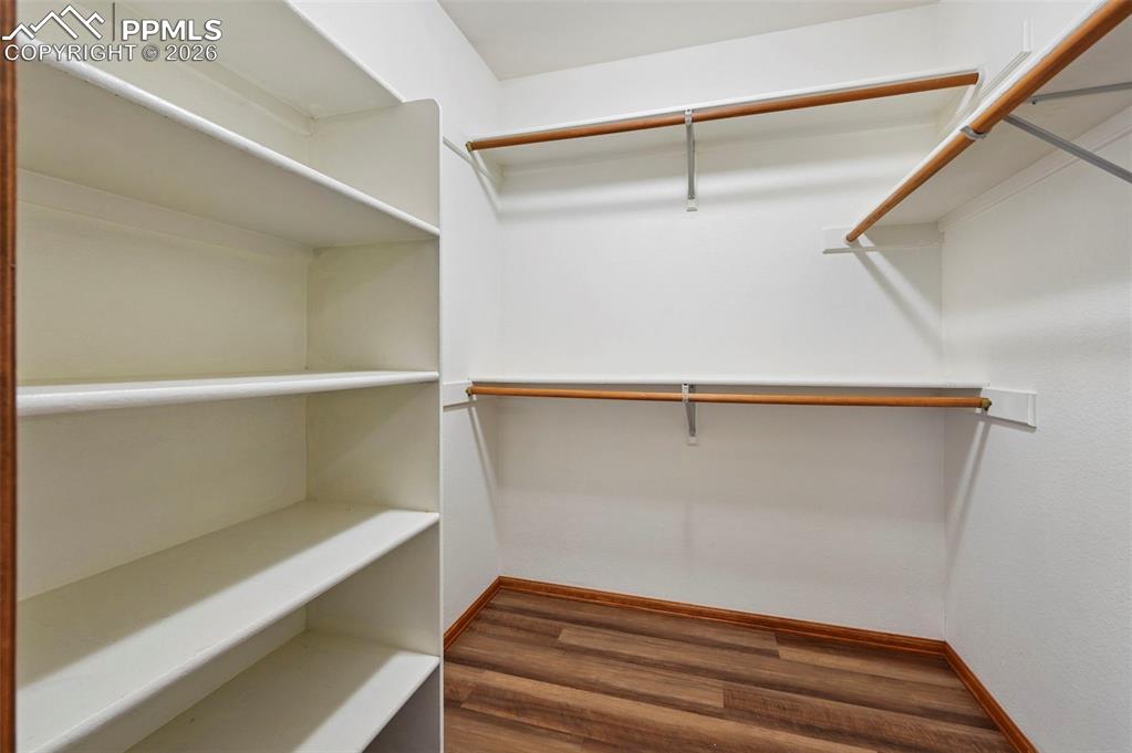 Image 28 of 49: Bedroom #2 New LVP flooring-Walk in Closet