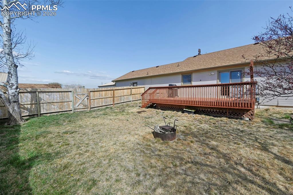 Image 31 of 49: Backyard Deck offers gas plumbed Grill Area. Spectacular Views of Pikes Pea